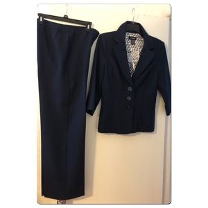 NWOT tag Suit set in size 8. Dark Navy Blue color.